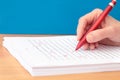 Hand with Pen Proofreading a Manuscript Royalty Free Stock Photo