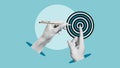 Hand with a pen pushes center of target symbolising development, business aim, creativity in teamwork and achievement growth Royalty Free Stock Photo