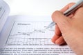 Hand with pen on stock chart Royalty Free Stock Photo