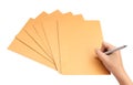 Hand with pen writing on the envelope on white background Royalty Free Stock Photo