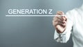 Hand with pen writing Generation Z in screen Royalty Free Stock Photo