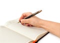 Hand with pen writing on notebook Royalty Free Stock Photo