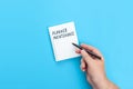 Hand with a pen writing in a notebook Planned maintenance Royalty Free Stock Photo