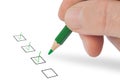 Hand with pencil and check boxes Royalty Free Stock Photo