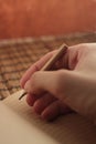 A hand with a pencil