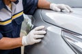 Hand of people using stainless steel wool to polishing the surface of car body