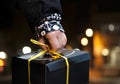 Hand of person carrying black box