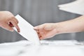 Hand of a person casting a vote Royalty Free Stock Photo