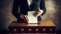 Hand of a person casting vote into the ballot box during elections Royalty Free Stock Photo