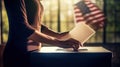 Hand of a person casting vote into the ballot box during elections Royalty Free Stock Photo