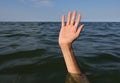 hand of the person who drowns in the sea