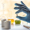 Hand of a pharmacist holds a capsule with dietary supplements Royalty Free Stock Photo