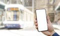 Hand with phone on the White background of the city bus. The idea for the app purchase an e-ticket for public transport, reading t Royalty Free Stock Photo