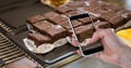 Hand photographing brownie on smart phone Royalty Free Stock Photo