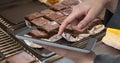 Hand photographing brownie through tablet PC Royalty Free Stock Photo