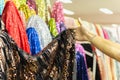 Hand pick a roll of Sequin fabric cloth in fabric store. Royalty Free Stock Photo