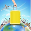 Hand pick suitcase with world travel landmark