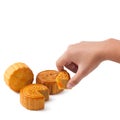 Hand pick up a slice of moon cake on white background