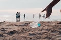 Hand picking bottle plastic on the beach Royalty Free Stock Photo