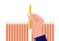 Hand picking one different pencil from the others, business concept of planning choosing the right target and resource