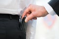 Hand Pickpocketing Wallet Of Businessman Royalty Free Stock Photo