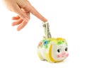 Hand with piggy bank