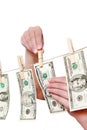 Hand pinch money on clothes line isolated Royalty Free Stock Photo