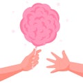 Hand with pink candy floss. Hand giving the cotton candy to child hand