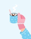Hand in pink mitten holding blue cup of hot chocolate drink with marshmallow. Hot winter drink. Vector illustration