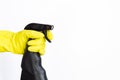 Hand in pink rubber glove holding black plastic spray detergent bottle. Household chemicals. Cleaning product Royalty Free Stock Photo