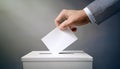 A hand placing a blank ballot into a voting box. Generative AI