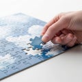 Hand placing final piece of blue sky jigsaw puzzle completion Royalty Free Stock Photo