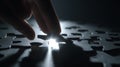 A Hand Placing the Final Piece of a Puzzle, Symbolizing Completion and the Joy of Solving Challenges Royalty Free Stock Photo