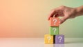 Hand Placing Question Mark Block Onto Stack Of Colorful Cubes Royalty Free Stock Photo