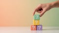 Hand Placing Question Mark Block Onto Stack Of Colorful Question Blocks Royalty Free Stock Photo