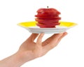 Hand with plate and chopped apple Royalty Free Stock Photo