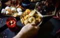 Hand with plate with figs as part of eastern sweets table Royalty Free Stock Photo