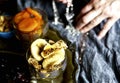 Hand with plate with figs as part of eastern sweets table Royalty Free Stock Photo