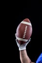 Hand of a player holding American football Royalty Free Stock Photo