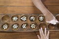 Hand playing marble game. Marbles game in wooden board. Royalty Free Stock Photo