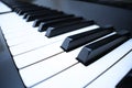 A hand playing with Piano keyboard background with selective focus. Cold color toned image Royalty Free Stock Photo