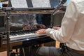 Hand playing on schimmel piano at party Event dinner Close-up Small depth of field