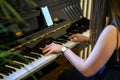 Hand playing on schimmel piano at party Event dinner Close-up Small depth of field