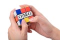 Hand playing Square puzzle to be OMG the well known expression o