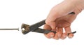 Hand with pliers and nail Royalty Free Stock Photo