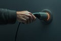 Hand Plugging Electric Charger into Wall Socket Royalty Free Stock Photo