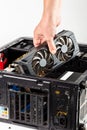 Hand plugging a video card while maintenance personal computer hardware with selective focus