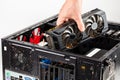 Hand plugging a video card while maintenance personal computer hardware with selective focus