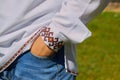 Hand in pocket,teenager holds his hands in his pockets, Ukrainian in an embroidered shirt Royalty Free Stock Photo