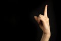 Hand point up. Education concept. Woman hand gesture, pointing sign, gesture look at this, pay attention. Black